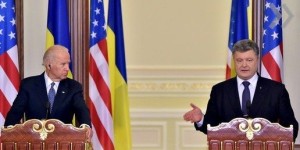 Ukrainian President Petro Poroshenko gestures beside U.S. Vice President Joe Biden as he delivers a statement on the results of their talks in Kiev
