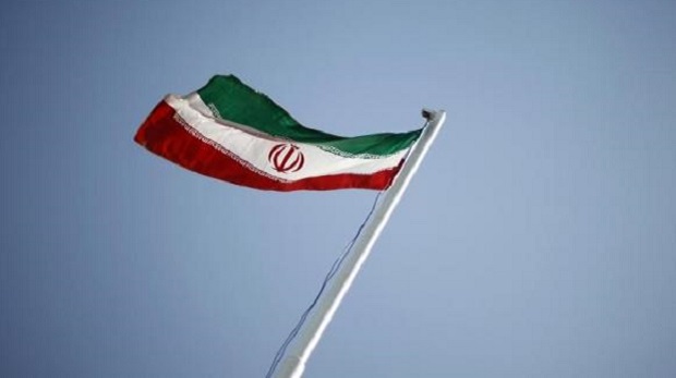 An Iranian national flag flutters during the opening ceremony of the 16th International Oil, Gas & Petrochemical Exhibition (IOGPE) in Tehran