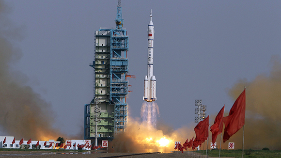 The Long March II-F rocket loaded with Shenzhou-9 manned spacecraft carrying Chinese astronauts Jing Haipeng, Liu Wang and Liu Yang lifts off from the launch pad in the Jiuquan Satellite Launch Center
